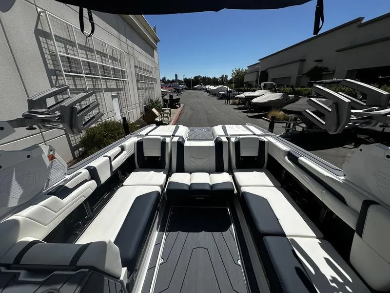 Slide: The Image of 2025 Malibu Wakesetter 25 LSV boat interior with spacious seating and sleek design. - 20