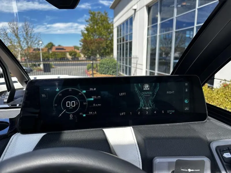 Slide: The Image of 2025 Malibu Wakesetter 25 LSV dashboard display with digital controls and navigation. - 21