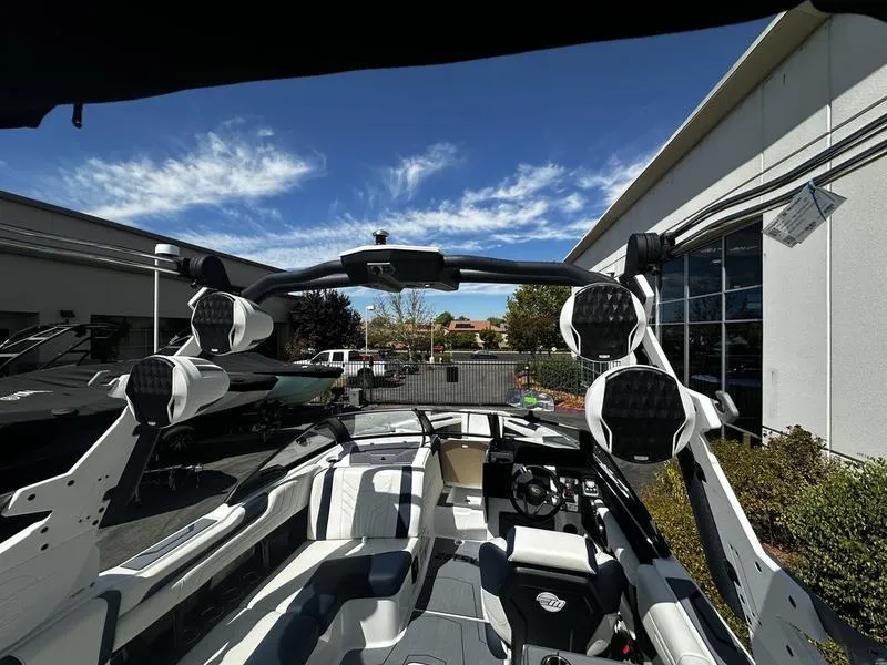 Slide: The Image of 2025 Malibu Wakesetter 25 LSV interior with advanced sound system and sleek design. - 23