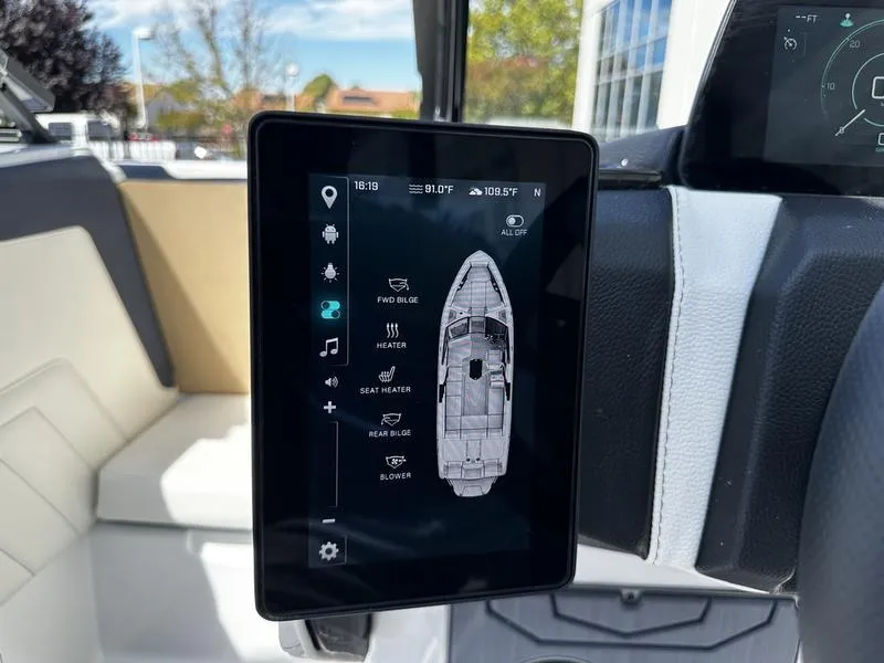 Slide: The Image of 2025 Malibu Wakesetter 25 LSV touchscreen display showing boat controls and settings. - 24