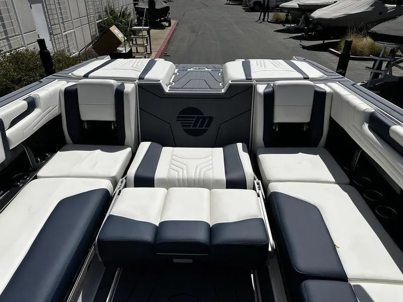 Slide: The Image of 2025 Malibu Wakesetter 25 LSV interior with luxurious seating and sleek design. - 25