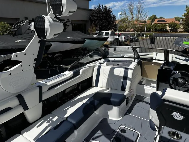 Slide: The Image of 2025 Malibu Wakesetter 25 LSV boat interior with sleek seating and modern design. - 26