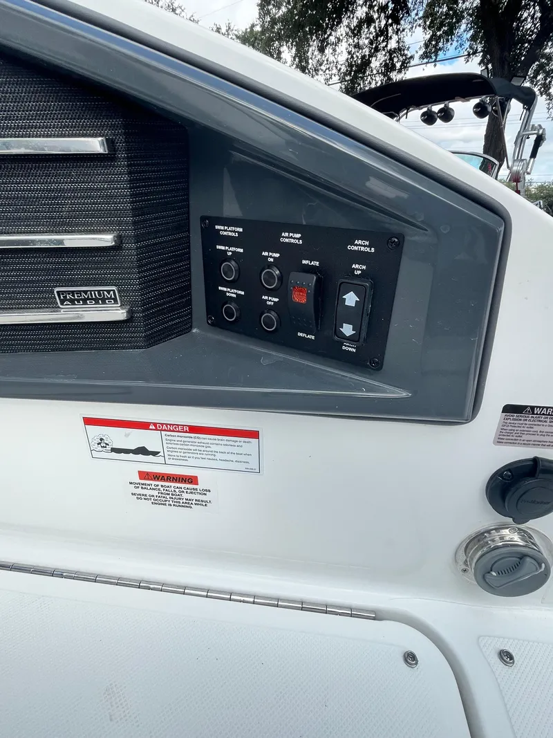 Slide: The Image of 2022 Cobalt A29 boat control panel with various switches and labels. - 11