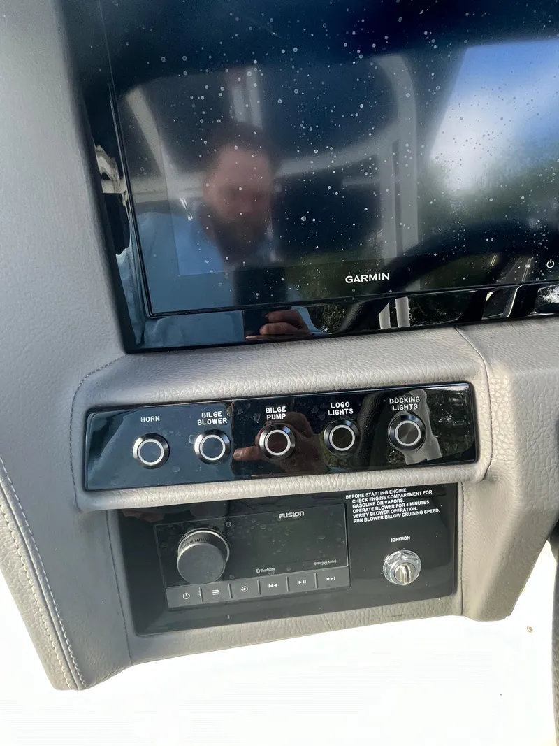 Slide: The Image of 2022 Cobalt A29 boat dashboard with Garmin display and control panel. - 17