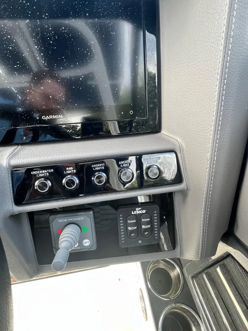 Slide: The Image of Control panel of 2022 Cobalt A29 boat with Garmin display and switches. - 18