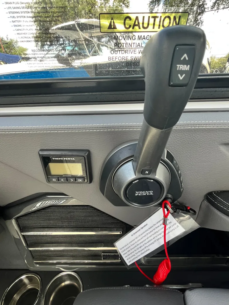 Slide: The Image of Throttle control lever on 2022 Cobalt A29 boat with caution label. - 19