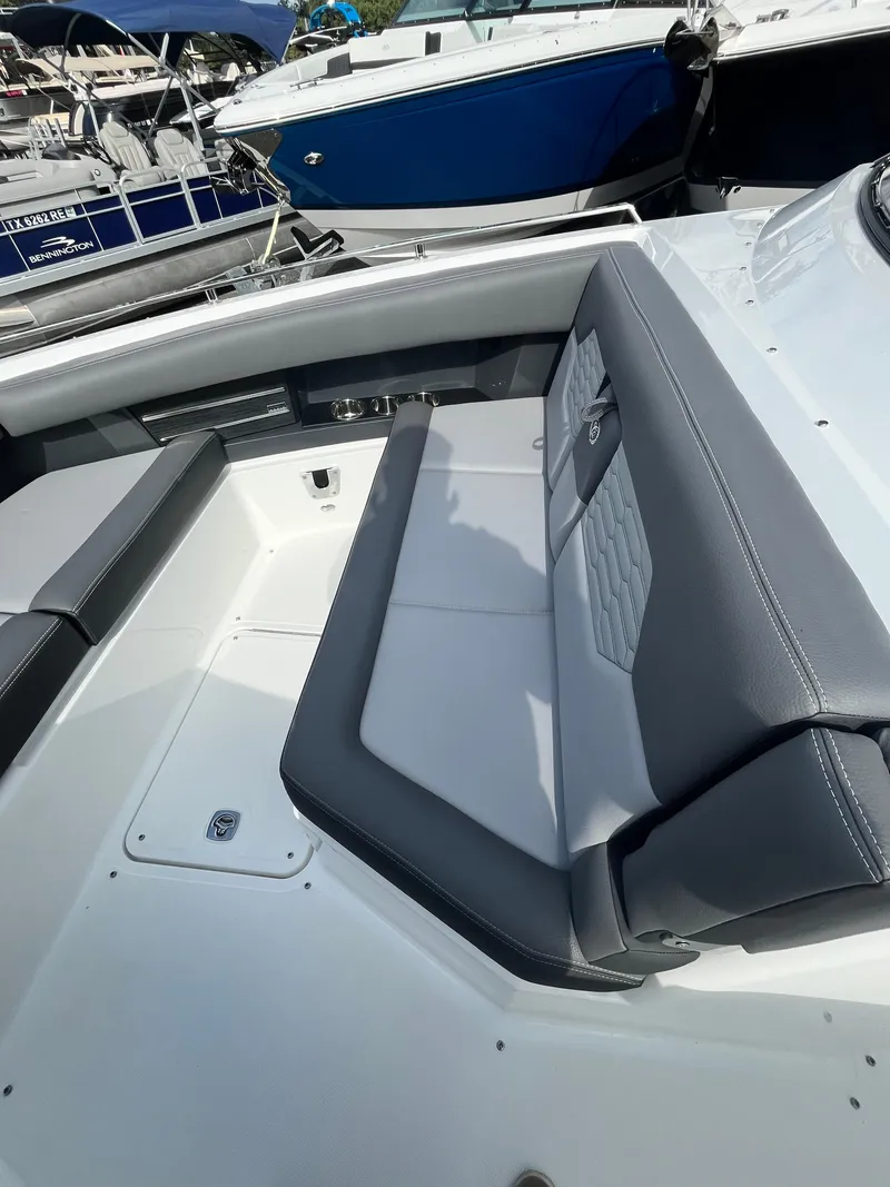 Slide: The Image of 2022 Cobalt A29 boat interior with gray seating and sleek design. - 24