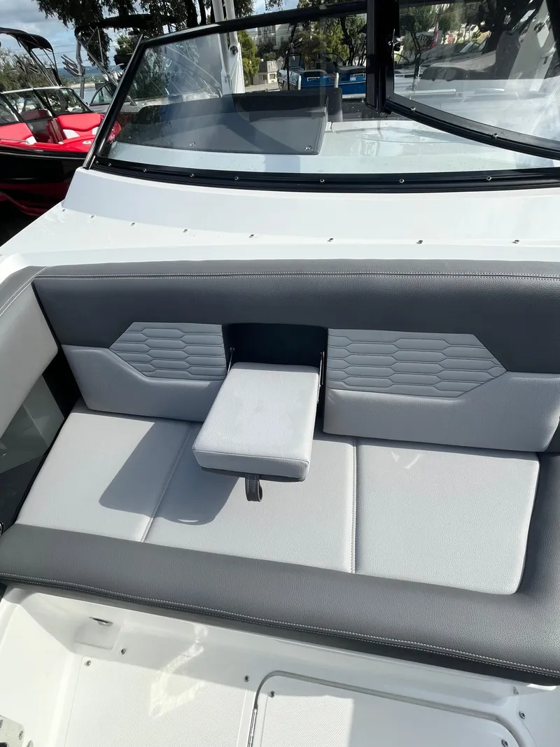Slide: The Image of 2022 Cobalt A29 boat interior with gray seating and modern design. - 26
