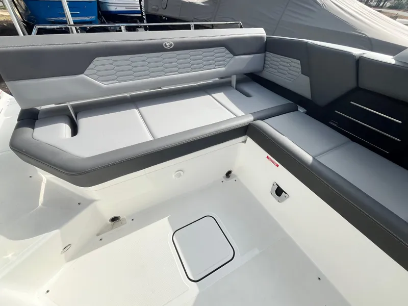 Slide: The Image of 2022 Cobalt A29 boat interior with gray seating and modern design. - 29