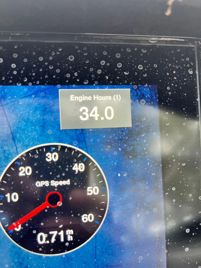 Slide: The Image of Cobalt A29 2022 dashboard showing 34 engine hours and GPS speed. - 34