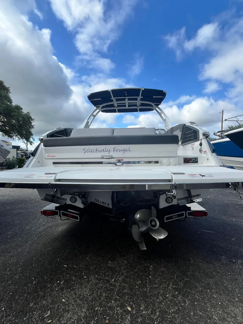 Slide: The Image of 2022 Cobalt A29 boat rear view under cloudy sky. - 4