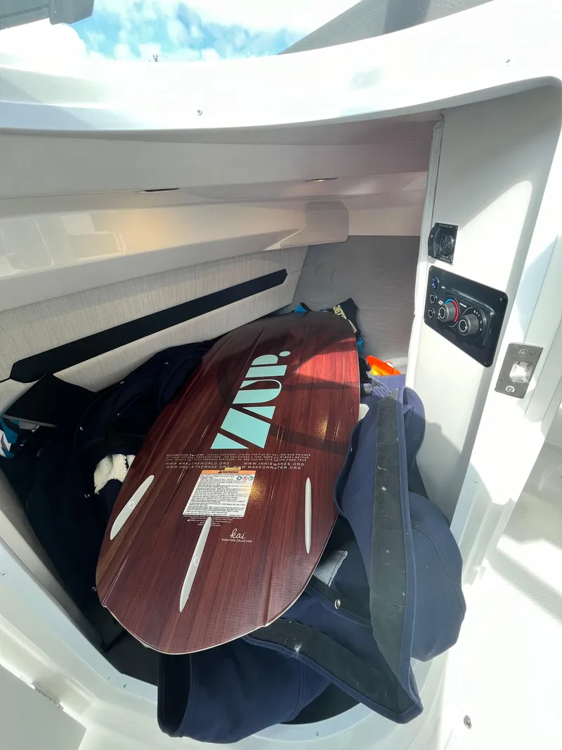 Slide: The Image of Wakeboard stored in a 2022 Cobalt A29 boat compartment. - 40
