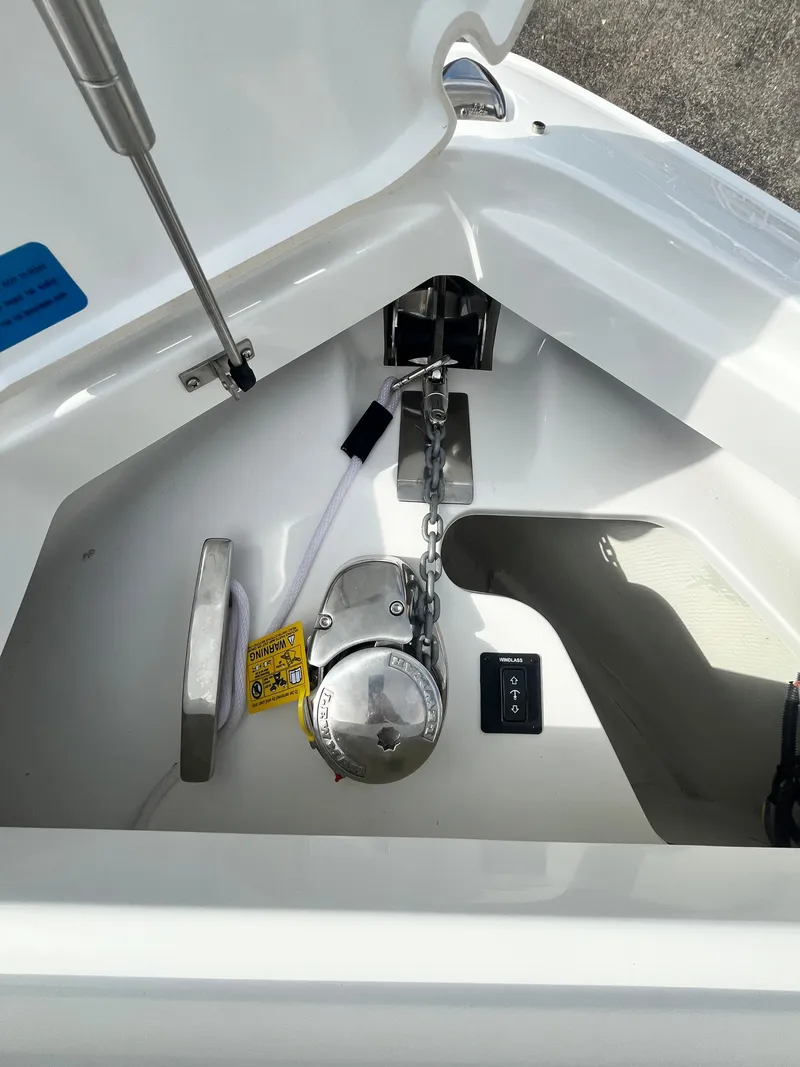 Slide: The Image of 2022 Cobalt A29 boat anchor compartment with chain and winch system. - 43