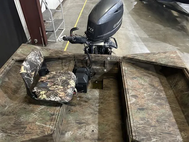 Slide: The Image of 2025 G3 18DK boat with Yamaha 70 engine, camo interior design. - 11