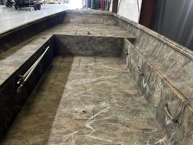 Slide: The Image of 2025 G3 18DK boat interior with camouflage design, featuring spacious seating and storage. - 12