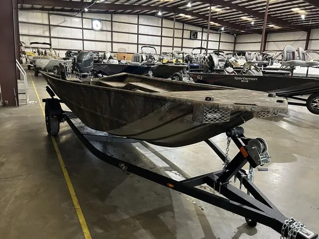 Slide: The Image of 2025 G3 18DK boat with Yamaha 70 engine on trailer in warehouse. - 3