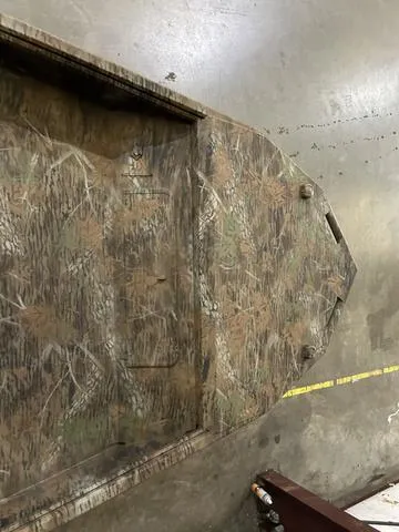 Slide: The Image of Camouflage-patterned G3 18DK boat hull, 2025 model, in a workshop setting. - 7