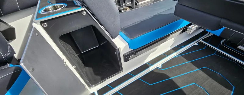 Slide: The Image of 2025 Malibu 25LSV interior with blue accents and storage compartment. - 11