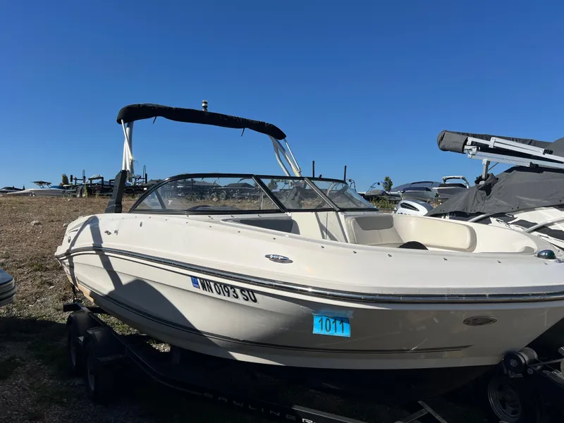 Slide: The Image of 2016 Bayliner VR6 boat on trailer under clear blue sky. - 13