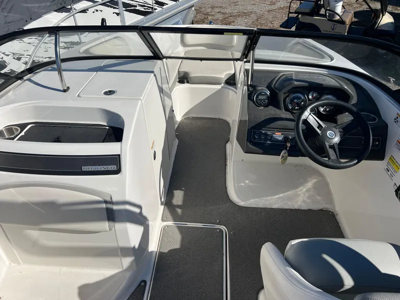 Slide: The Image of 2016 Bayliner VR6 boat interior with steering wheel and dashboard. - 17