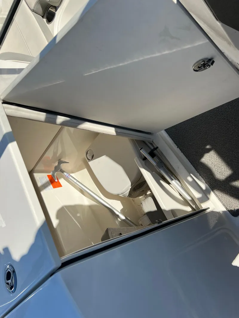 Slide: The Image of Open storage compartment in 2016 Bayliner VR6 boat. - 21