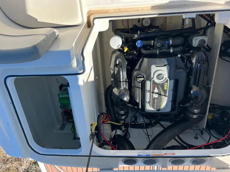 Slide: The Image of Engine compartment of a 2016 Bayliner VR6 boat, showcasing the 4.3L MerCruiser engine. - 26