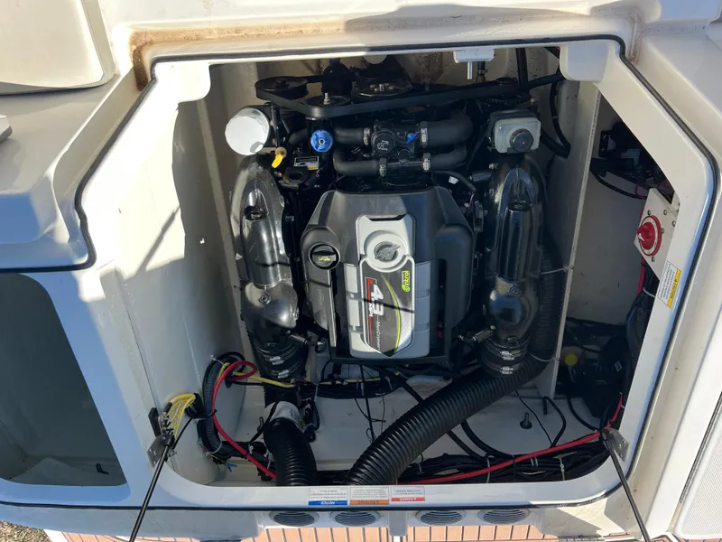 Slide: The Image of Engine compartment of a 2016 Bayliner VR6 boat, showcasing detailed mechanical components. - 27