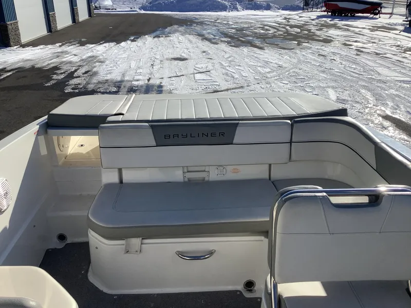 Slide: The Image of 2016 Bayliner VR6 boat interior with seating, parked on snowy ground. - 29