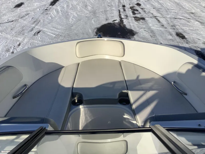 Slide: The Image of 2016 Bayliner VR6 boat interior with cushioned seating, viewed from above. - 30