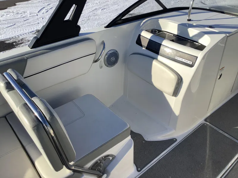 Slide: The Image of Interior of a 2016 Bayliner VR6 boat, featuring seating and dashboard details. - 34