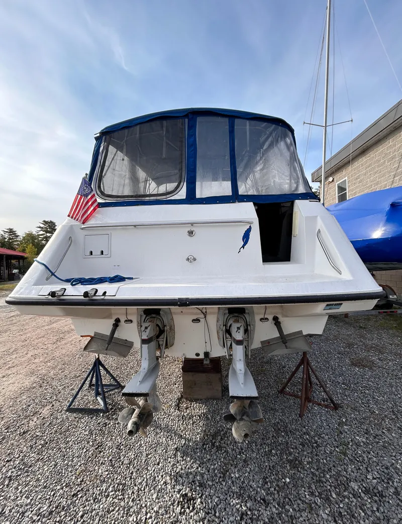 Slide: The Image of 1992 Chaparral Signature 30 boat on stands, rear view with American flag. - 15