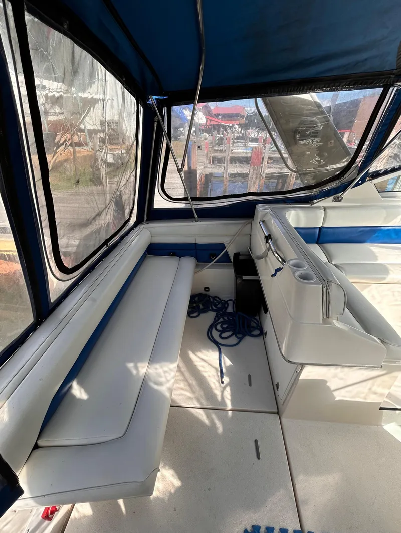 Slide: The Image of 1992 Chaparral Signature 30 boat interior with seating and blue accents. - 18