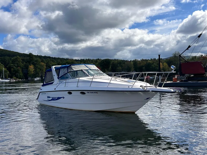 Slide: The Image of 1992 Chaparral Signature 30 boat on calm water under cloudy sky. - 2