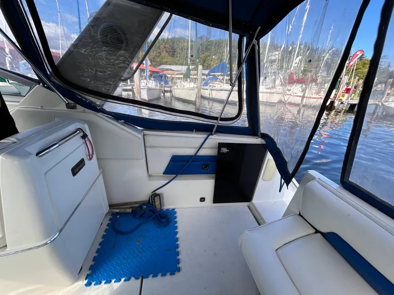 Slide: The Image of Interior of a 1992 Chaparral Signature 30 boat with blue and white seating. - 20