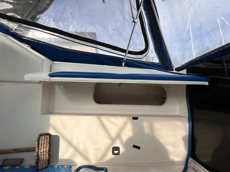 Slide: The Image of Interior view of a 1992 Chaparral Signature 30 boat with blue and white seating. - 21