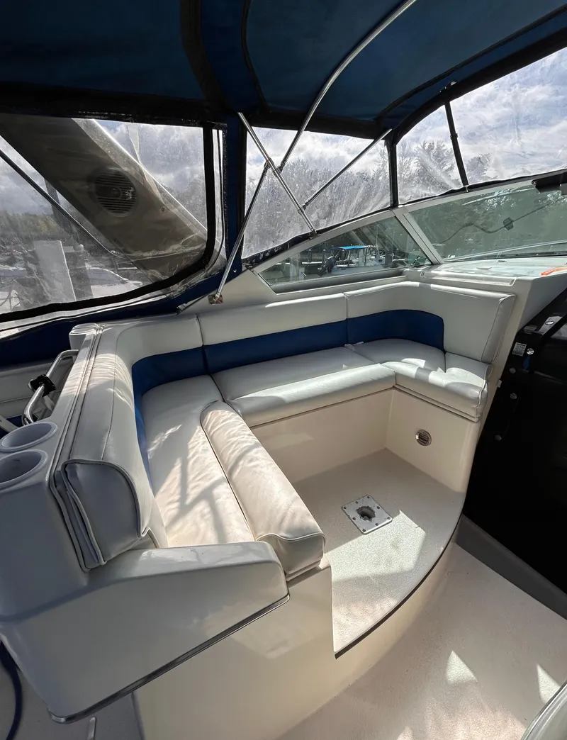 Slide: The Image of 1992 Chaparral Signature 30 boat interior with white and blue seating. - 26