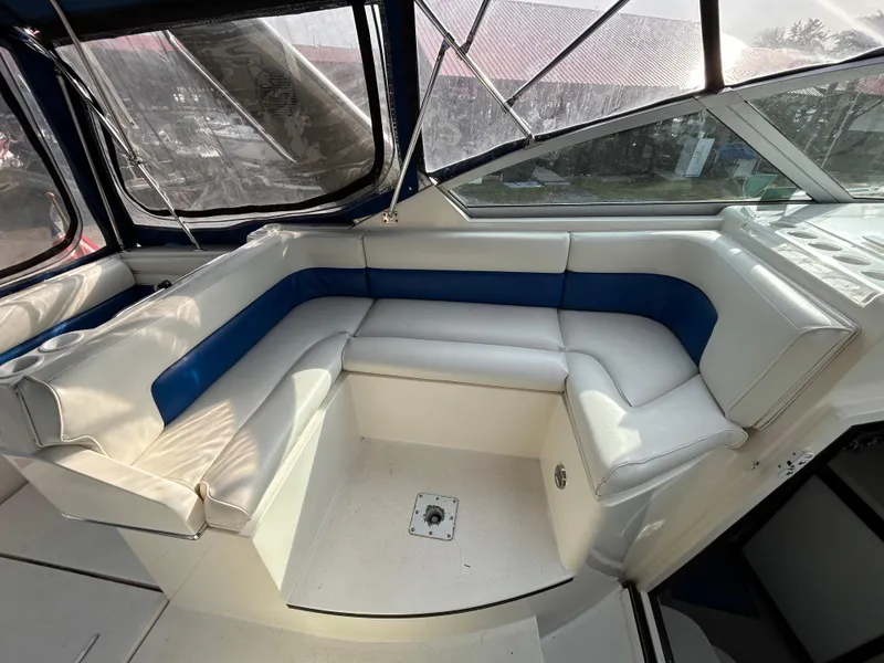 Slide: The Image of Interior seating of 1992 Chaparral Signature 30 boat with white and blue upholstery. - 27