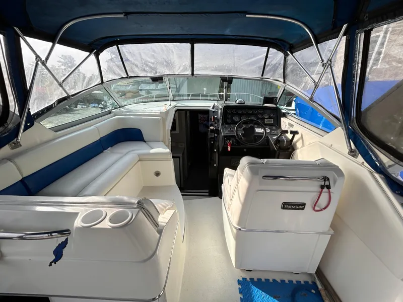 Slide: The Image of 1992 Chaparral Signature 30 boat interior with steering wheel and seating area. - 29