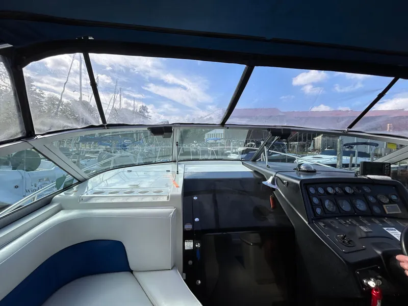 Slide: The Image of Interior view of 1992 Chaparral Signature 30 boat cockpit with dashboard and seating. - 30