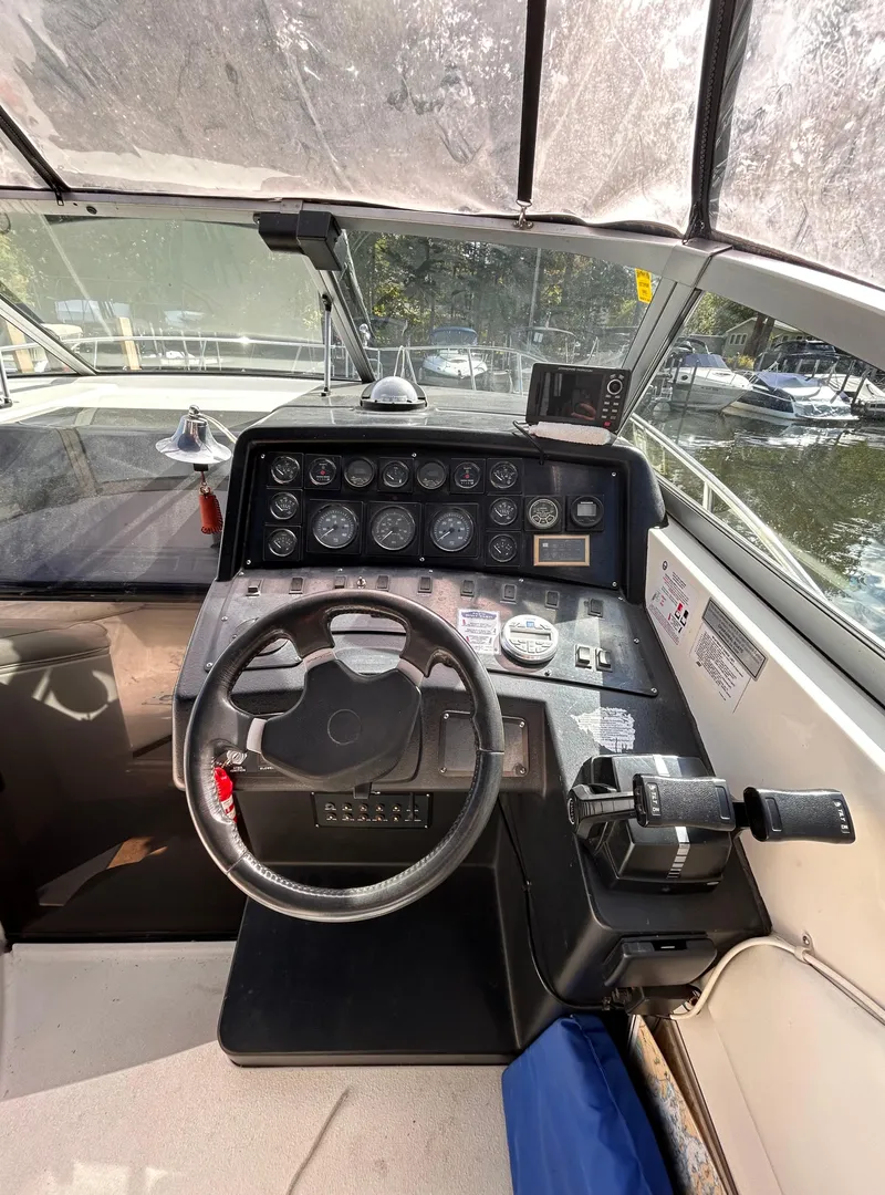 Slide: The Image of 1992 Chaparral Signature 30 boat cockpit with steering wheel and instrument panel. - 32