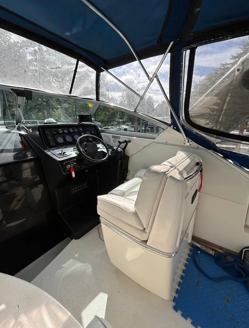 Slide: The Image of 1992 Chaparral Signature 30 boat interior with steering wheel and seating. - 37