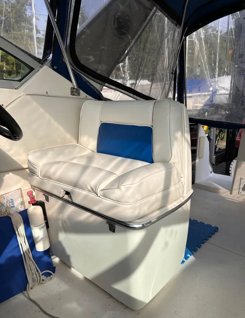 Slide: The Image of 1992 Chaparral Signature 30 boat interior with white and blue seating. - 38