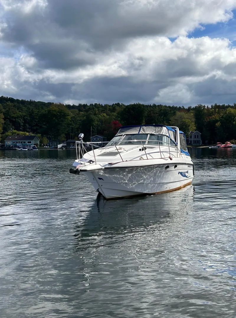 Slide: The Image of 1992 Chaparral Signature 30 boat on a calm lake under cloudy skies. - 4