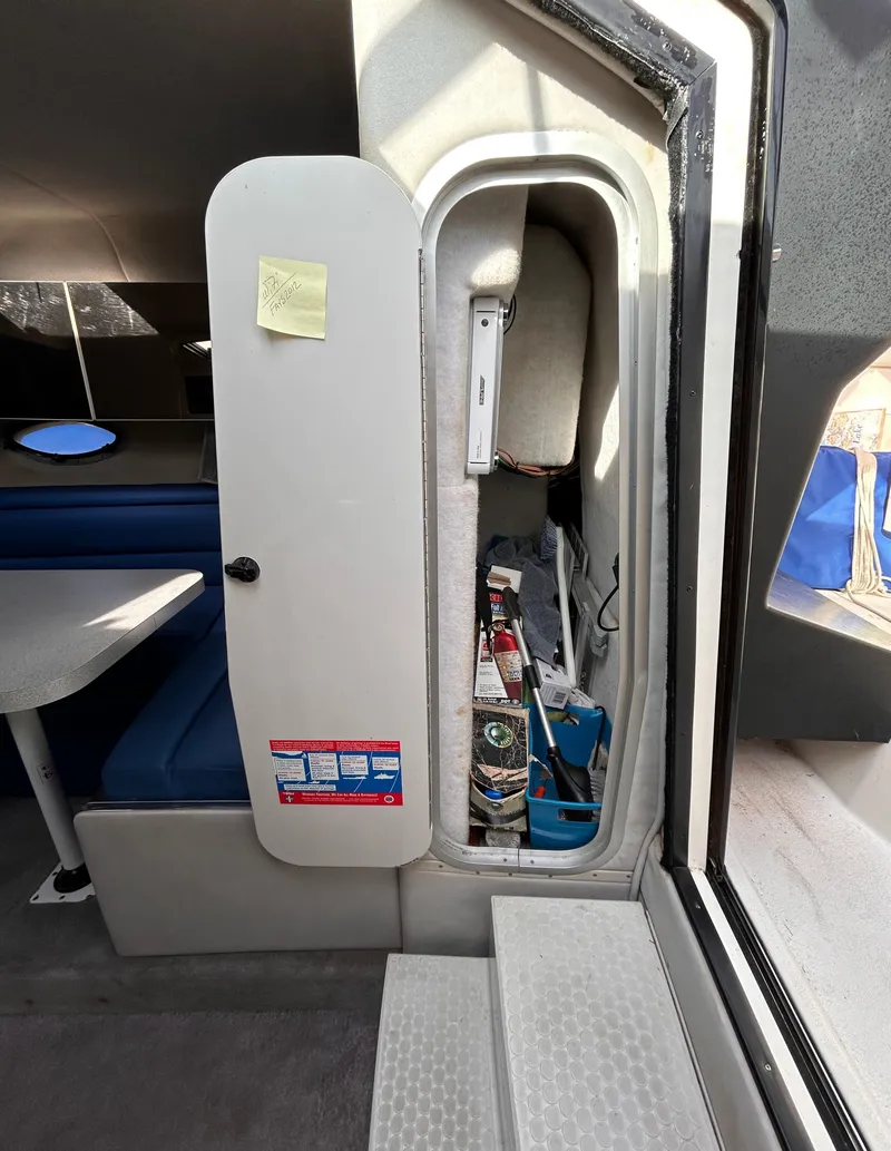 Slide: The Image of Interior view of a 1992 Chaparral Signature 30 boat, showing a storage compartment. - 42