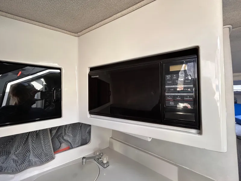 Slide: The Image of 1992 Chaparral Signature 30 interior with built-in microwave and modern design. - 46