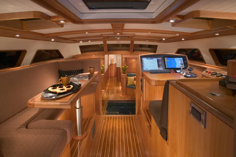 Slide: The Image of Luxurious interior of a 2002 Northern Marine Pilothouse Sloop with wood finish and navigation equipment. - 10