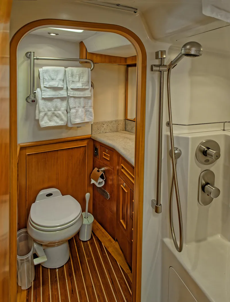 Slide: The Image of Luxurious 2002 Northern Marine Pilothouse Sloop bathroom with wood accents and modern fixtures. - 14