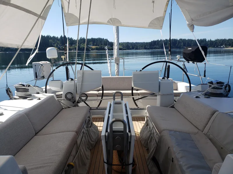 Slide: The Image of 2002 Northern Marine Pilothouse Sloop interior with dual steering wheels and comfortable seating. - 24