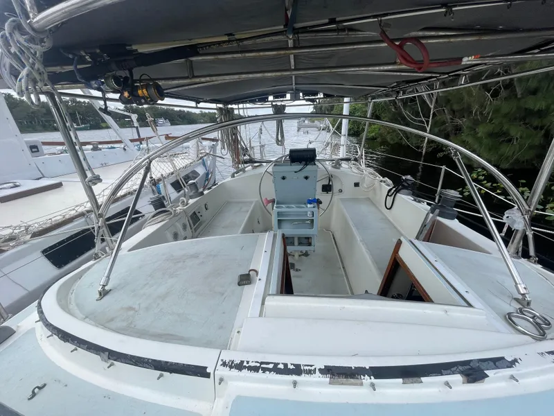 Slide: The Image of 1979 Moody 36 Classic sailboat cockpit with steering wheel and navigation equipment. - 17