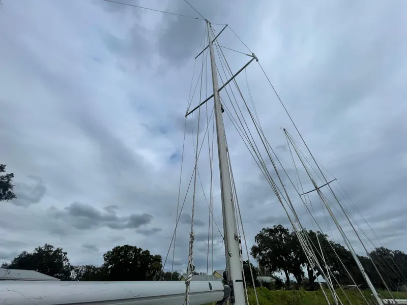 Slide: The Image of 1979 Moody 36 Classic sailboat mast against cloudy sky. - 23